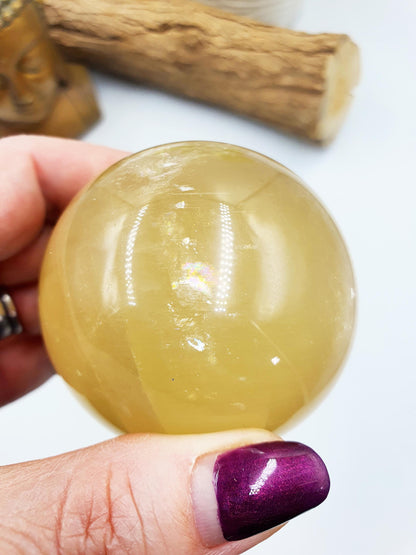 Flashy Yellow Calcite Sphere with rainbows