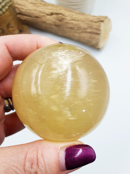 Flashy Yellow Calcite Sphere with rainbows