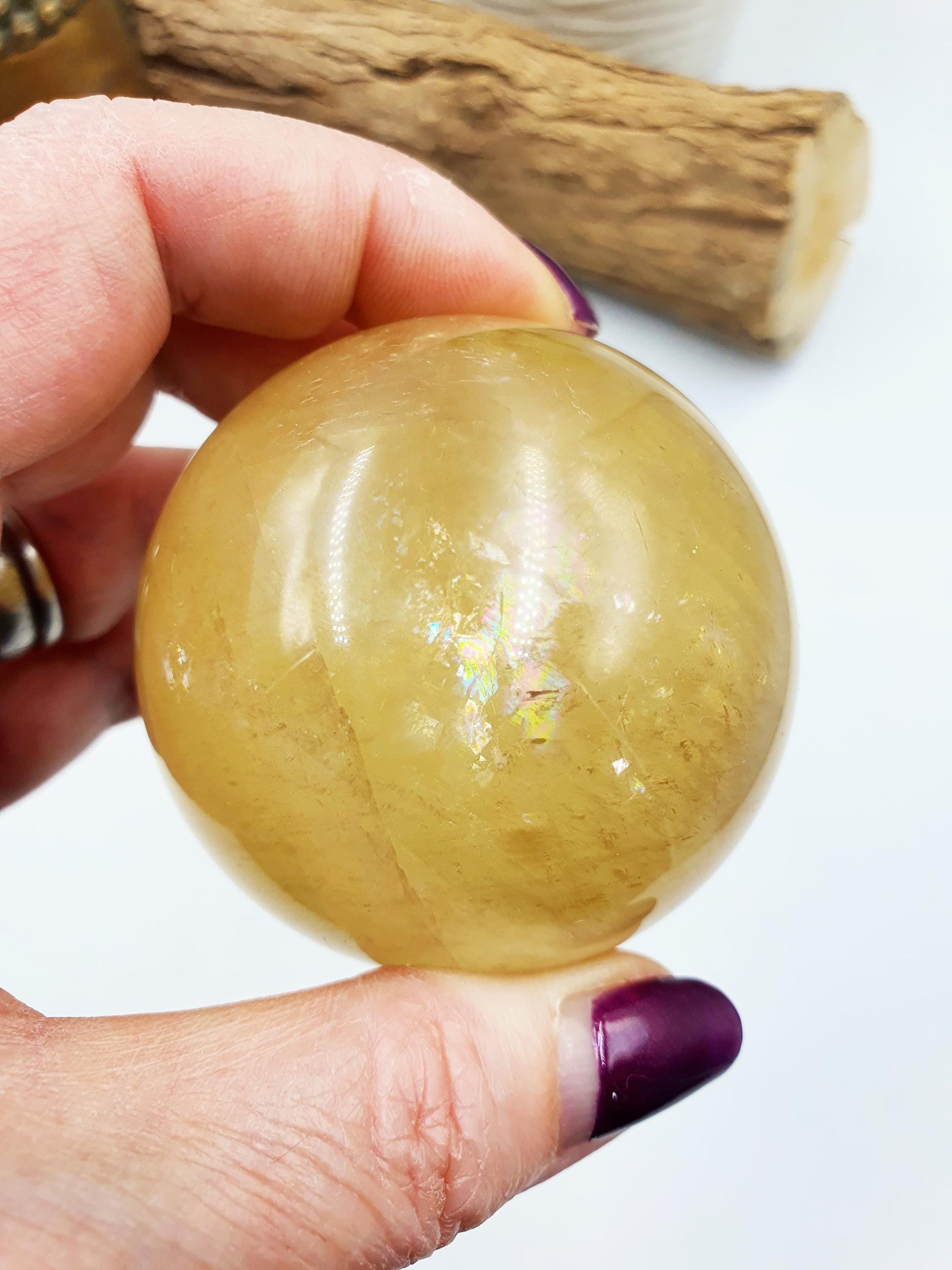 Flashy Yellow Calcite Sphere with rainbows