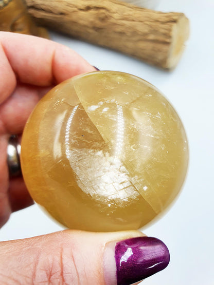 Flashy Yellow Calcite Sphere with rainbows