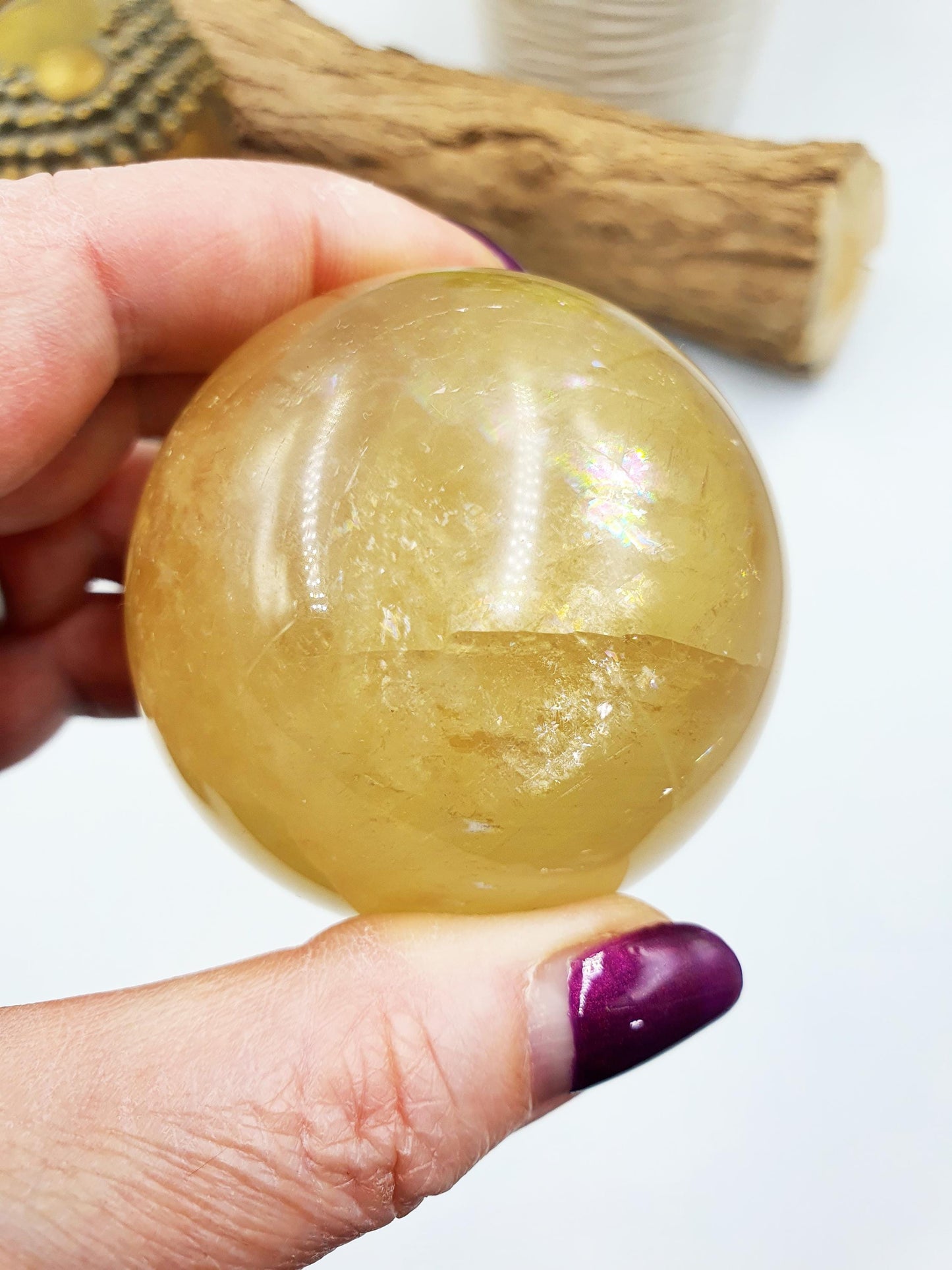 Flashy Yellow Calcite Sphere with rainbows