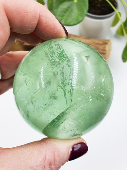 A Grade Green Fluorite Sphere with rainbows