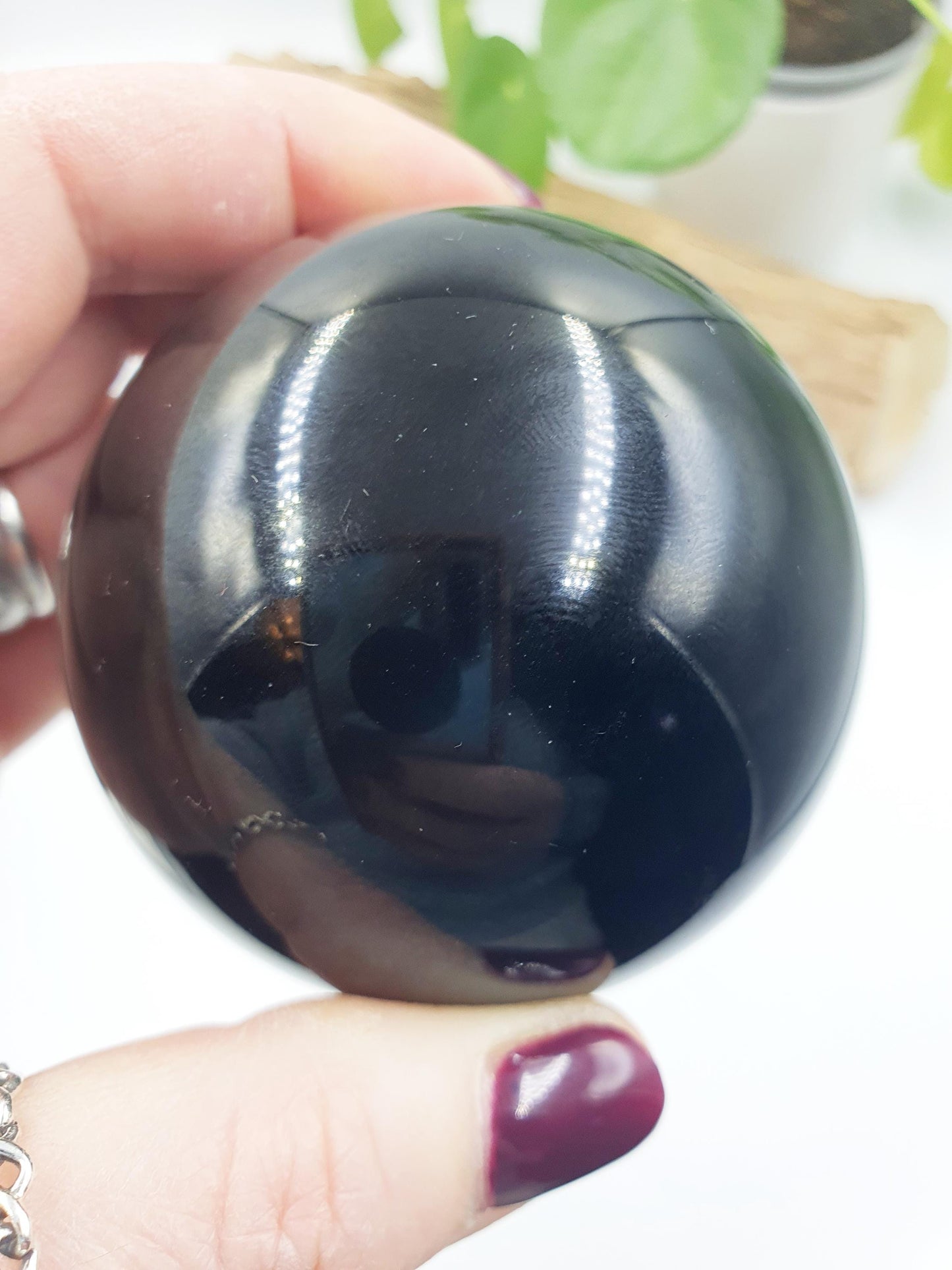 Obsidian Sphere with flashes of colour