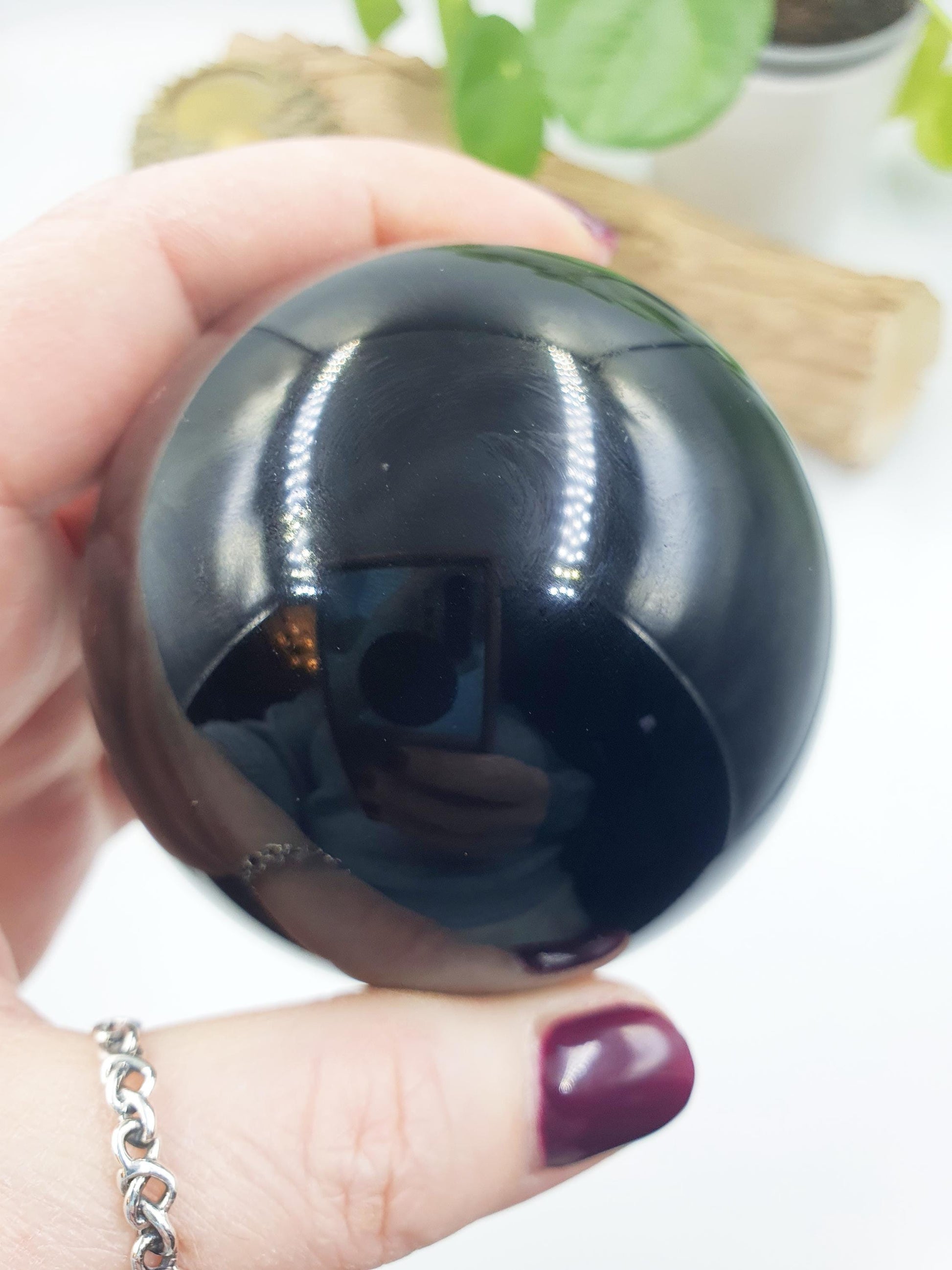 Obsidian Sphere with flashes of colour