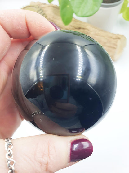 Obsidian Sphere with flashes of colour