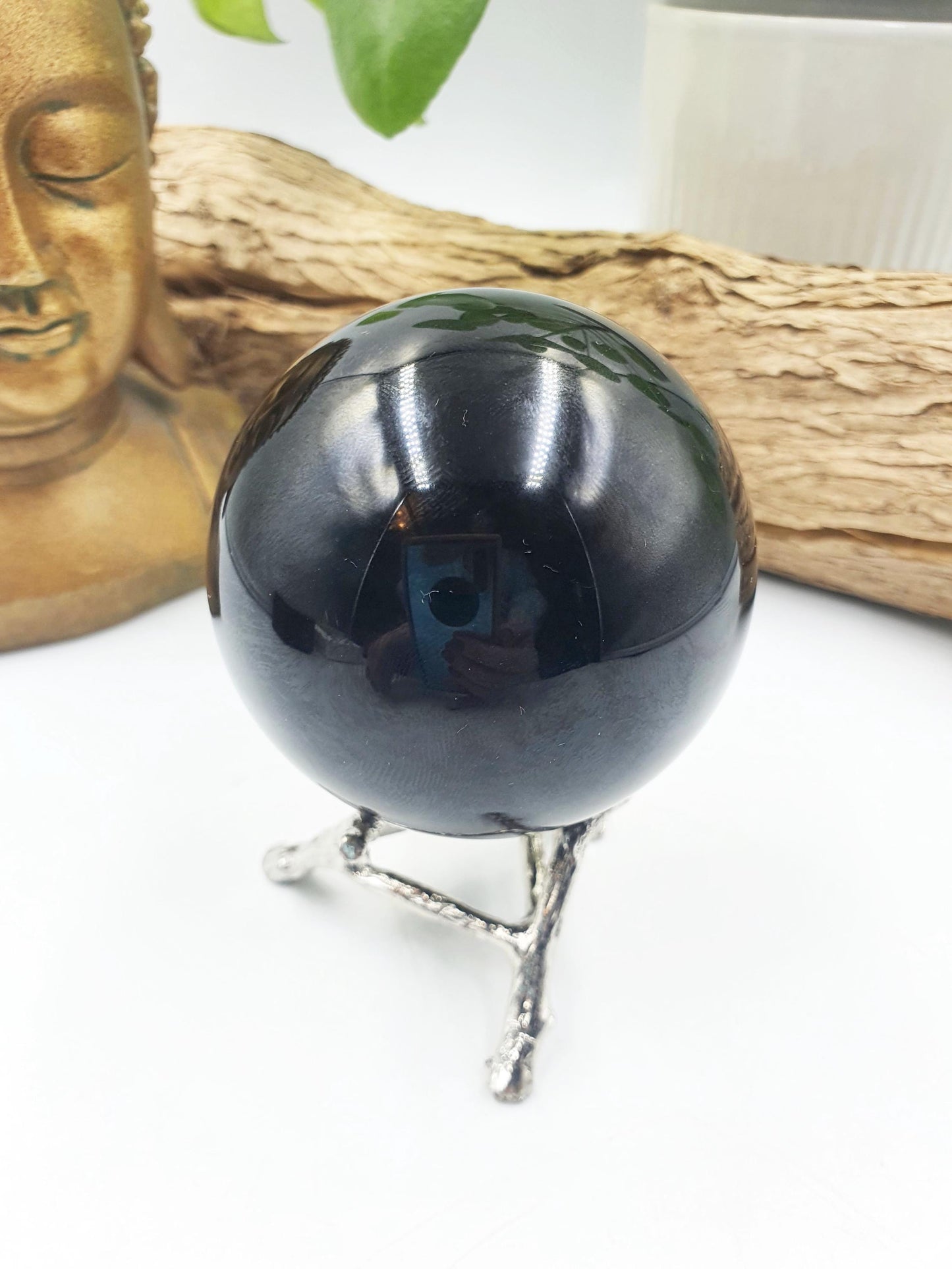 Obsidian Sphere with flashes of colour