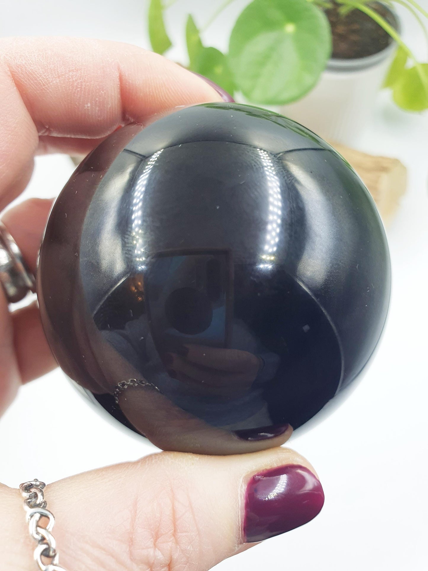 Obsidian Sphere with flashes of colour