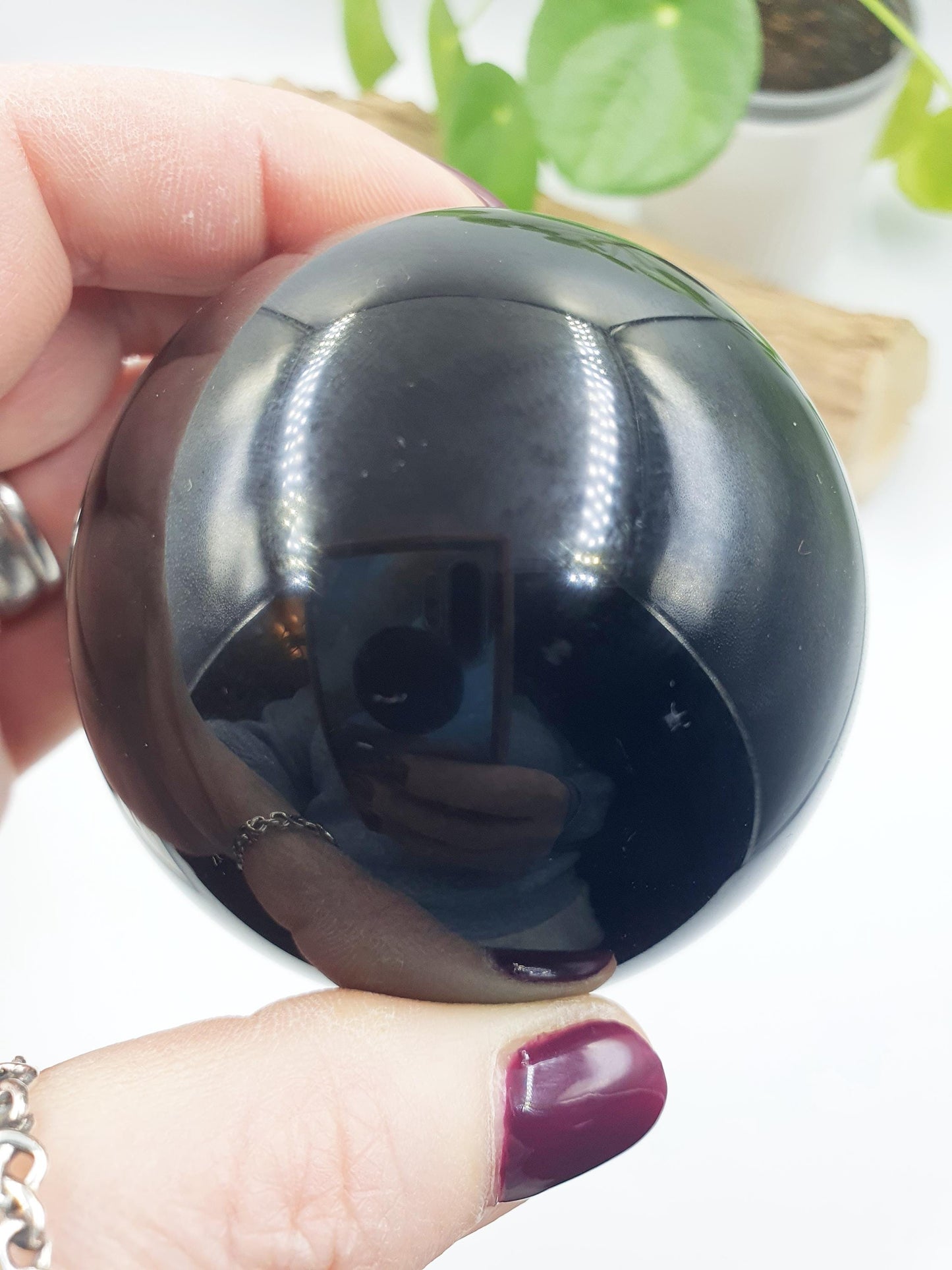 Obsidian Sphere with flashes of colour